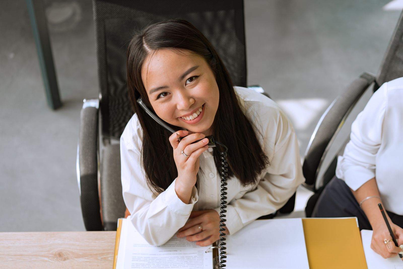Marie taking a call in the Sparkle Pane office